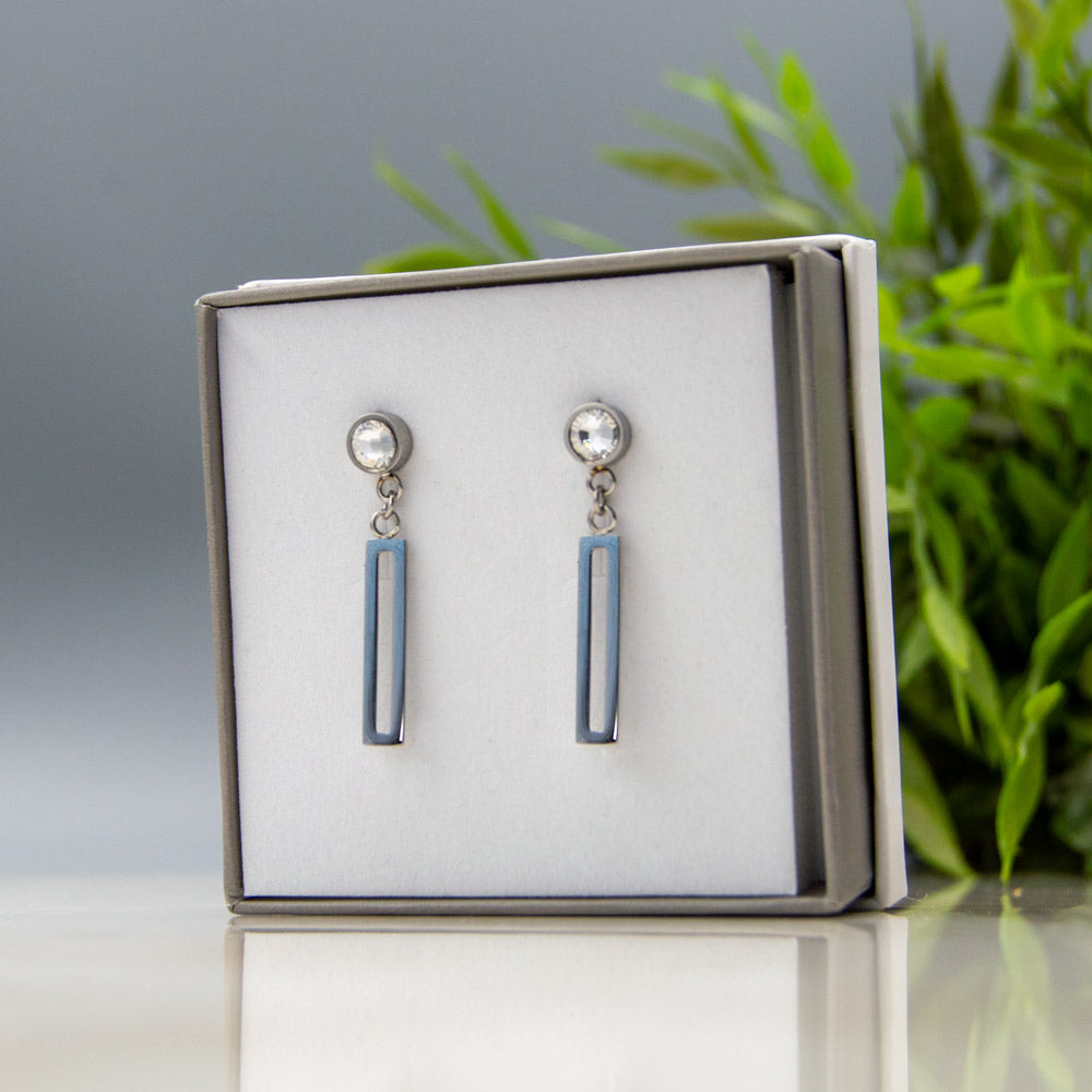 Silver coloured magnetic drop earrings in Luxury eco-friendly gift box as part of the Magnetic Mobility - April Birthstone triple gift set. 