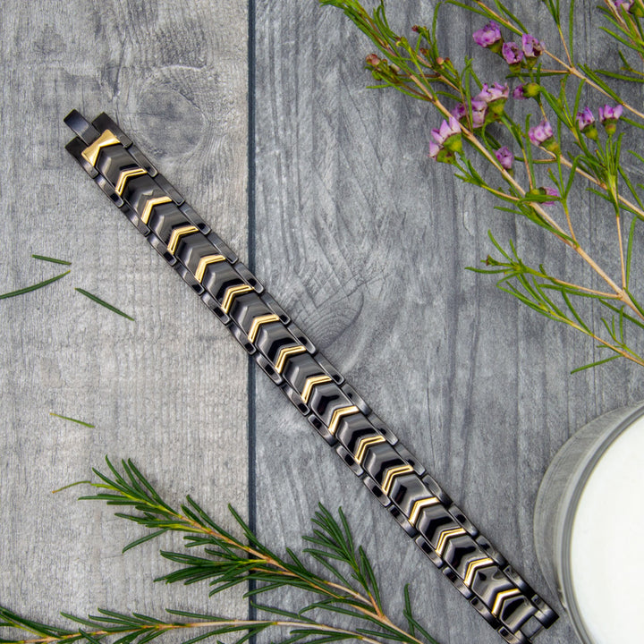 Top view of Sage Twilight Magnetic Bracelet’s striking black and gold chevron design, ideal for those seeking style and arthritis support.