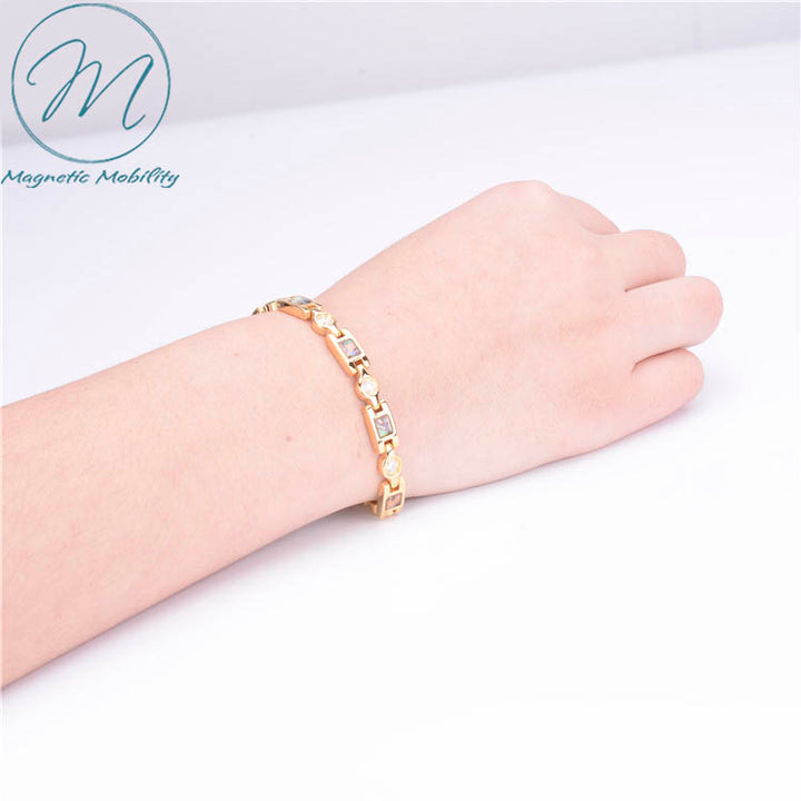 Avens summer - womens magnetic bracelet with 4 health elements on model wrist. 